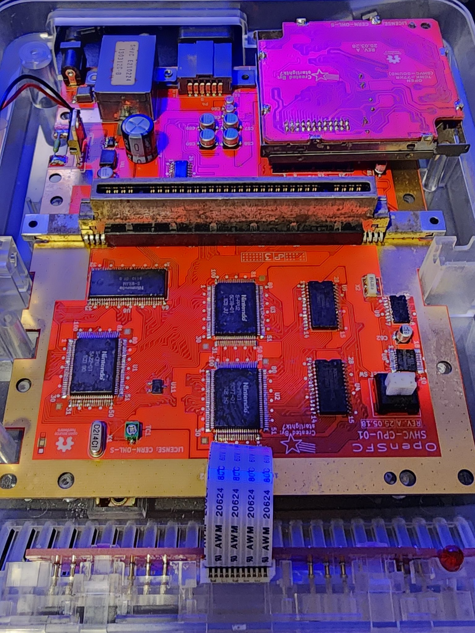 OpenSFC SHVC-CPU-01 red build assembled in a clear case.